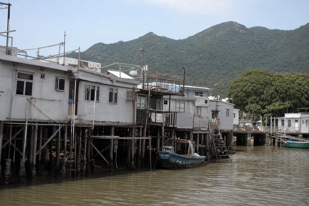 Stilt houses standing over the water at Tai O fishing village, no text, no logos, no people
