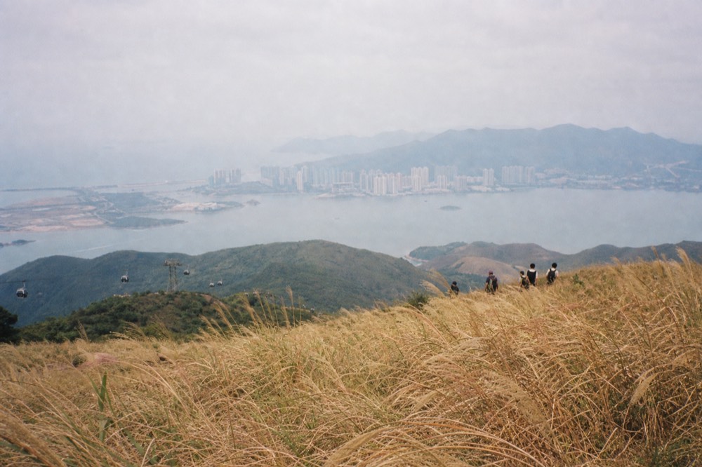 Four islands seen from a Hong Kong hillside across open water, no text, no logos, no people