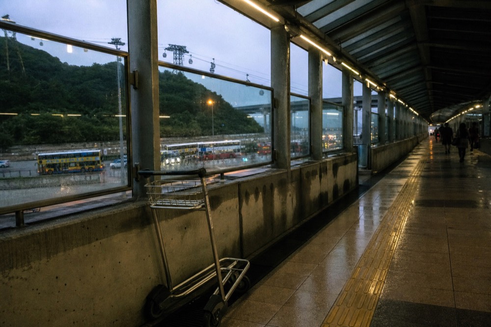 Covered walkway between Tung Chung MTR station and the cable car terminal, no text, no logos, no people