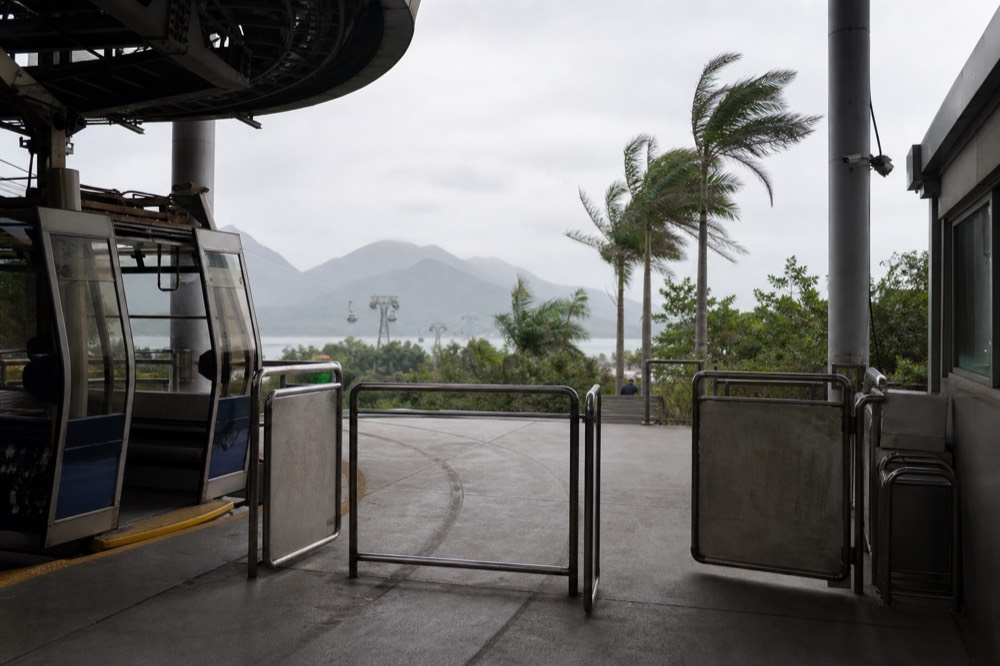 Empty boarding platform at the Tung Chung cable car terminal, no text, no logos, no people