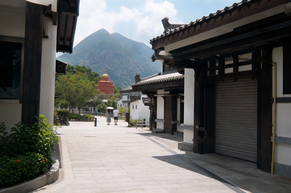 Walkway and shopfronts in Ngong Ping Village, no text, no logos, no people
